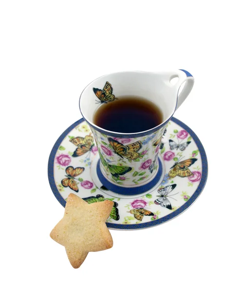 Šálek čaje s cookie v podobě hvězdy — Stock fotografie