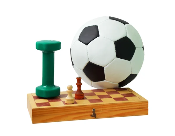 Fotboll, schackbräde, schackpjäser och hantel — Stockfoto
