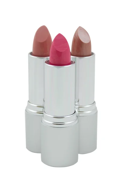 Three multicolored lipsticks, close-up — Stock Photo, Image
