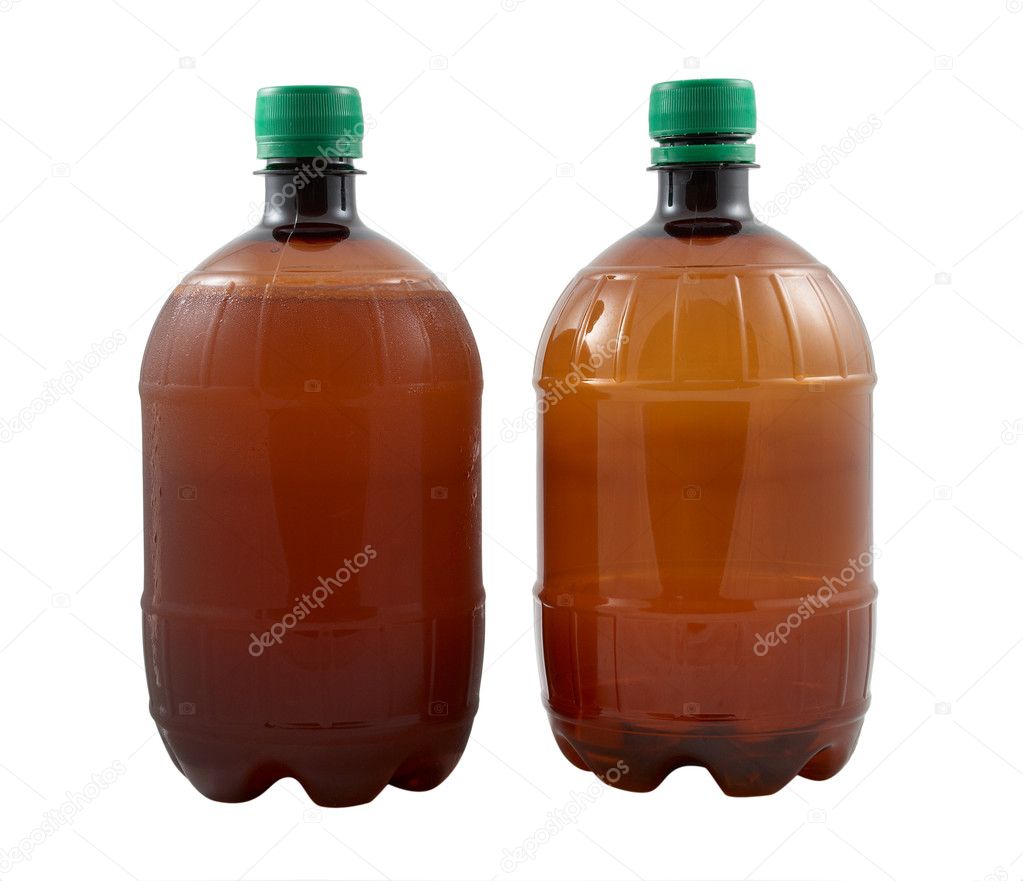 Full and empty beer bottles on a white