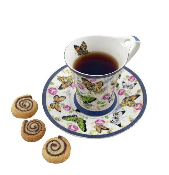 Cup of tea with cookies in the shape of snails — Stock Photo, Image