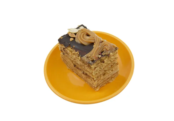Piece of honey cake on a plate — Stock Photo, Image