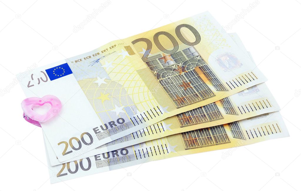 200 euro banknotes in the clip for money, over white