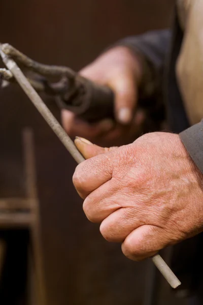 The hands of men working with a lever — Stock Photo, Image