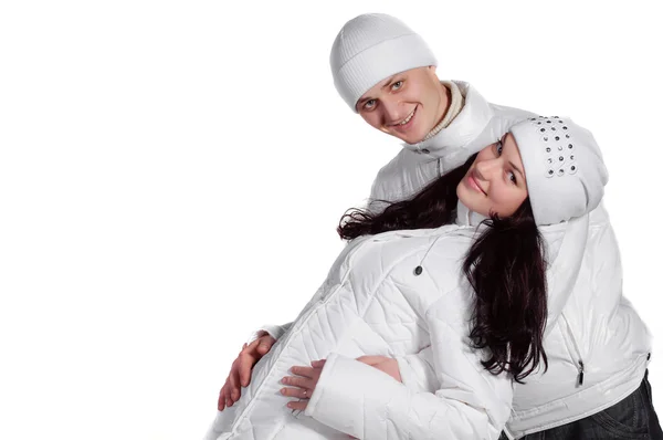 Mutlu erkek ve kadın kış beyaz elbise — Stok fotoğraf
