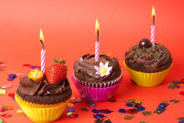 stock image Miniature chocolate cupcakes with candle