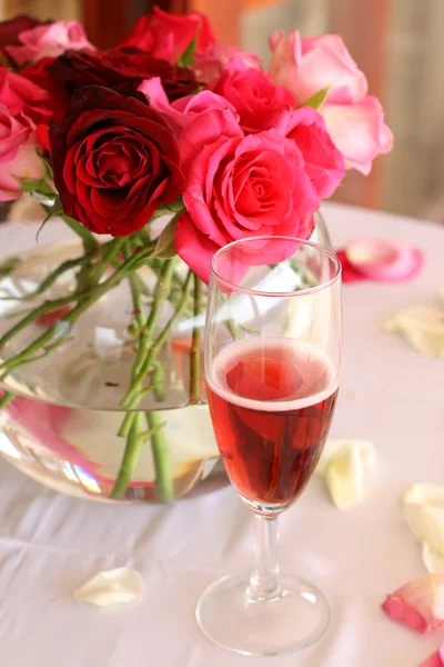 stock image Bouquet of roses and glass of champagne