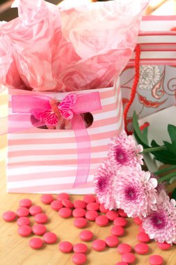 Two gift bags with pink candy around clipart