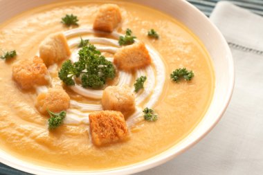 Bowl of fresh butternut soup clipart