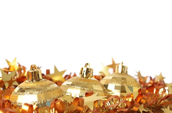 Gold Christmas baubles on tinsel — Stock Photo, Image