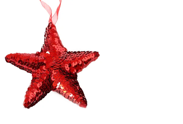 Red shiny Christmas star on white — Stock Photo, Image