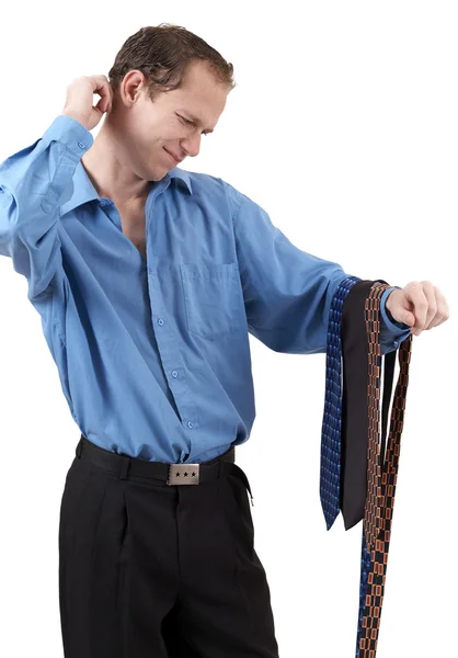 Businessman choosing a tie — Stock Photo, Image