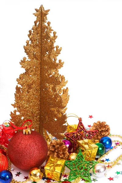 Red Christmas baubles with a golden tree — Stock Photo, Image