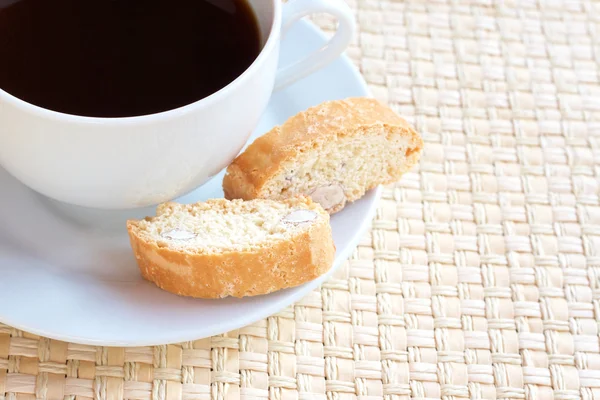 Cup of hot coffee and almond biscotti cookies — Stock Photo, Image
