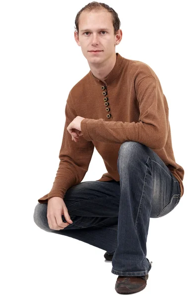 Young caucasian man sitting down — Stock Photo, Image