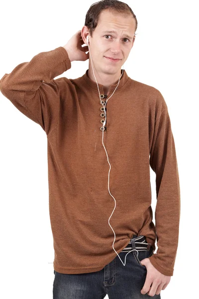 Young caucasian man listening to music — Stock Photo, Image