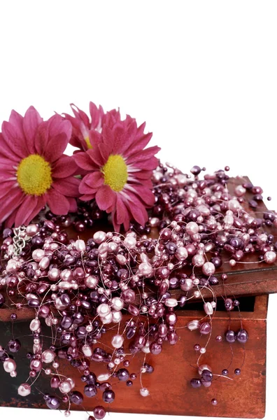 Fake pink pearls with pink flowers — Stock Photo, Image
