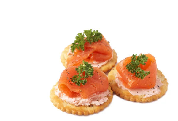 Smoked salmon and cream cheese on crackers — Stock Photo, Image
