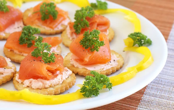 stock image Smoked salmon and cream cheese on crackers