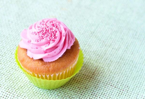 Vanilla cupcake with strawberry icing — Stock Photo, Image