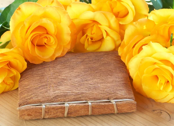 Yellow roses on a book — Stock Photo, Image