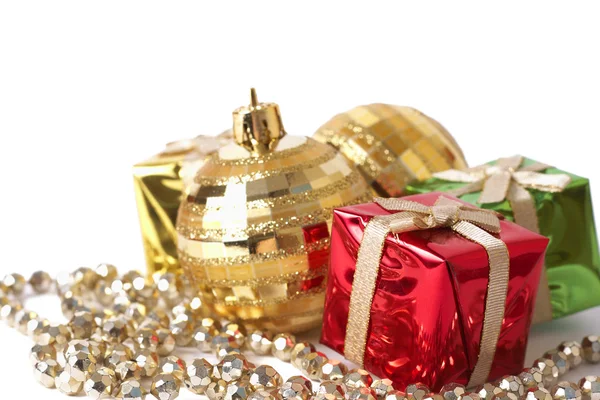 Christmas gift boxes, baubles and beads — Stock Photo, Image