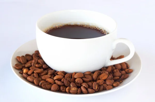 Cup of fresh coffee with roast beans — Stock Photo, Image