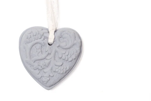 Stock image Grey stone heart on white