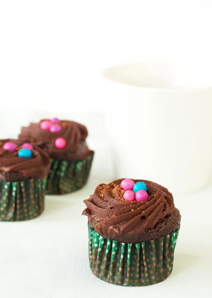 Miniature chocolate cupcakes and coffee — Stock Photo, Image