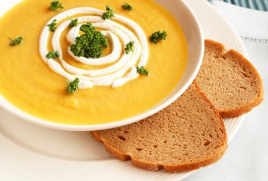 Bowl of fresh butternut soup clipart