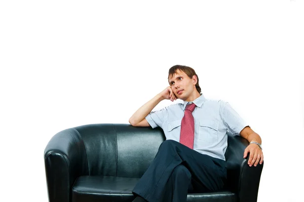 The businessman sits on a sofa — Stock Photo, Image