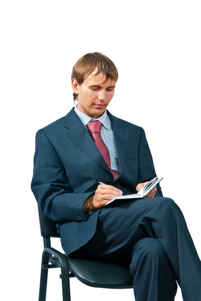 El hombre de negocios con un cuaderno — Foto de Stock
