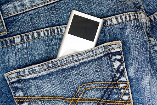 Mp3 music player in jeans pocket — Stock Photo, Image