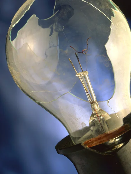 Bulb on a dark blue background — Stock Photo, Image