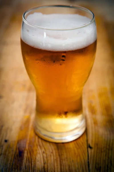 stock image Beer on wooden background