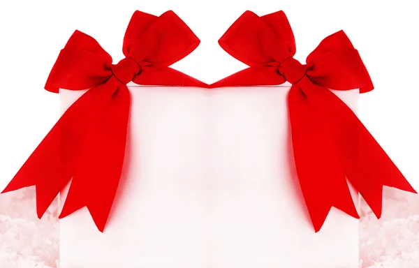 Beautiful red bows over blank card — Stock Photo, Image