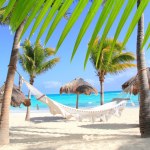 Two beach chairs on idyllic tropical white sand beach. Shadow from the ...