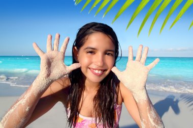 Llatin teen girl playing beach smiling sandy hands clipart