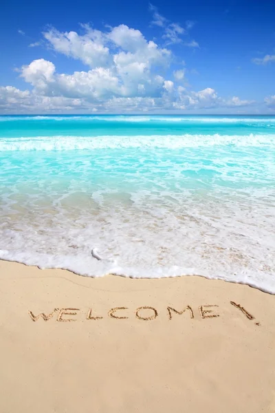 Greetings welcome beach spell written on sand — Stock Photo, Image