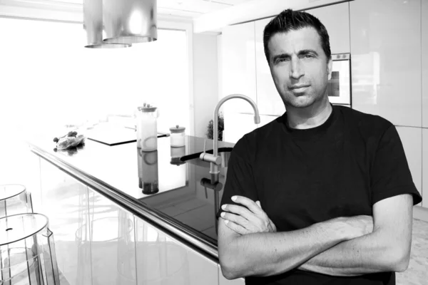 Medium age man in modern kitchen interior portrait — Stock Photo, Image