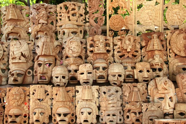 Mayan wood mask rows Mexico handcraft faces — Stock Photo, Image