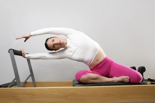 Gym woman pilates stretching sport in reformer bed — Stock Photo, Image