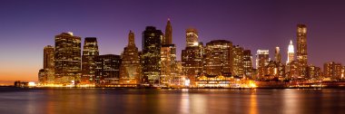 New York - Panoramic view of Manhattan Skyline by night clipart