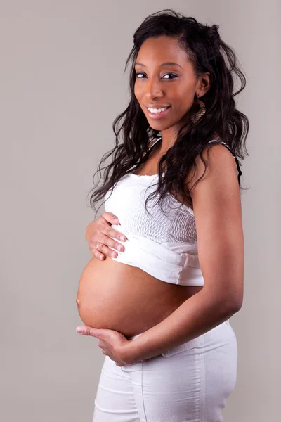 Těhotná žena se svou dcerou — Stock fotografie