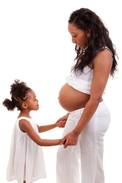 Mujer embarazada con su hija — Foto de Stock