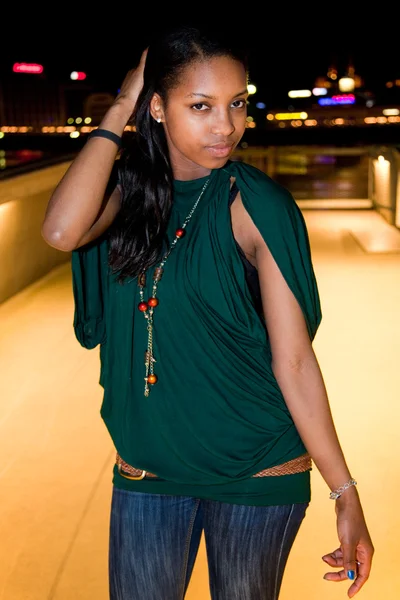 Portrait of young black woman in city at night. — Stock Photo, Image