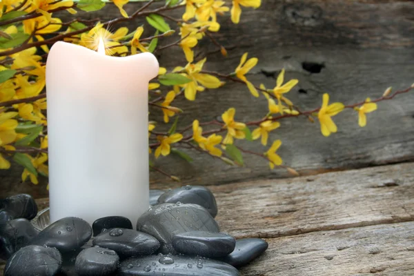 Candle and River Rocks — Stock Photo, Image