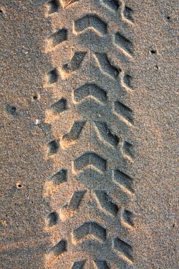 Tire tracks on the sand clipart