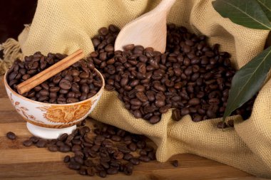 Beans of coffee on a bowl clipart