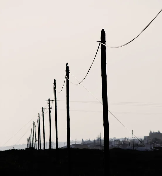 Poles on sunset — Stock Photo, Image
